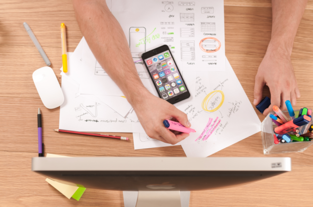 Person looking at charts on a desk